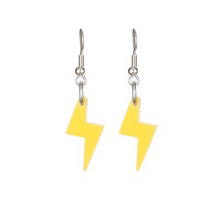 Yellow bolt earrings, close-up