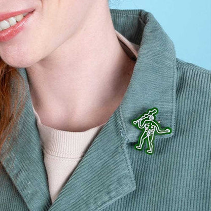 Cerne Abbas brooch on a green corduroy jacket