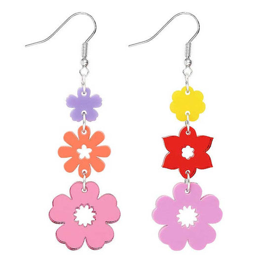 Long drop earrings of three acrylic flowers in lilac, orange and pink