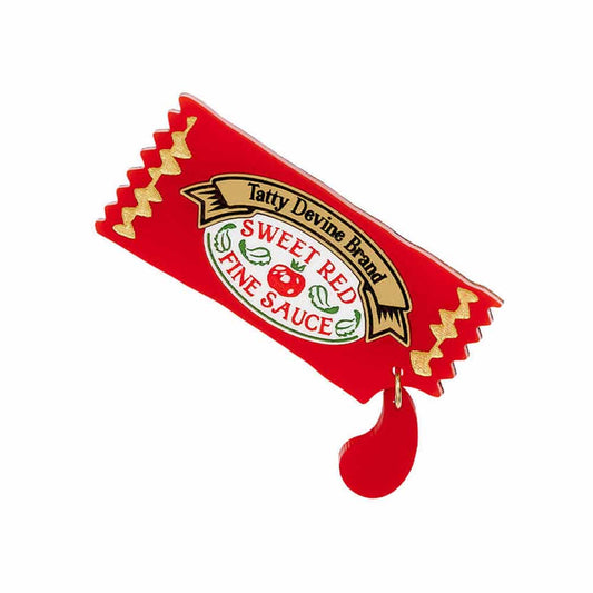 Tatty Devine ketchup sachet brooch with a drip of red sauce