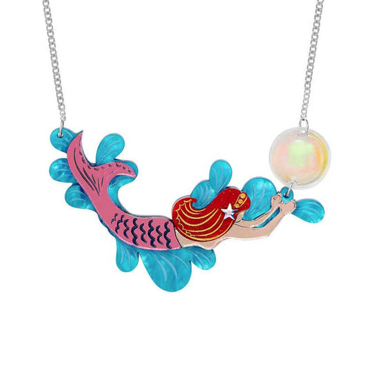 Tatty Devine mermaid splash necklace: a red-haired mermaid swimming through blue waves with a bubble