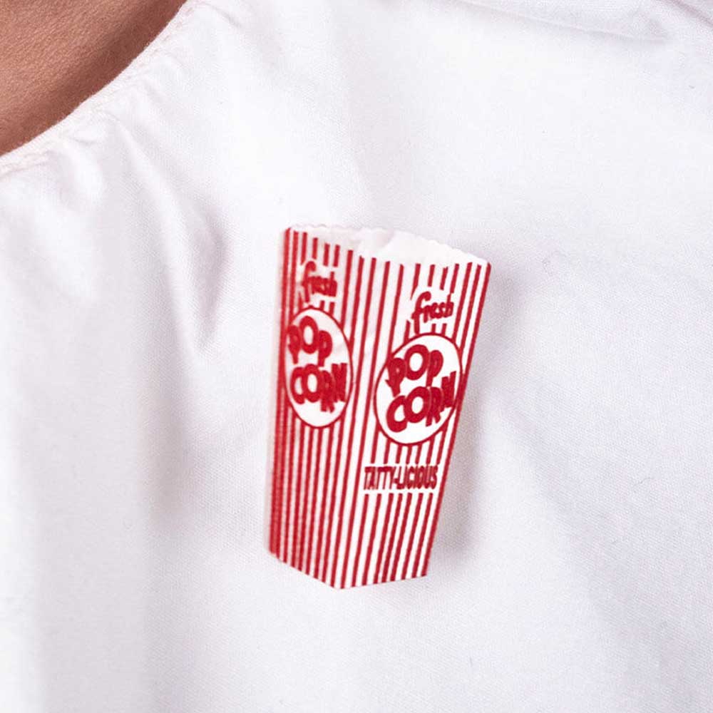 Popcorn brooch on a white shirt