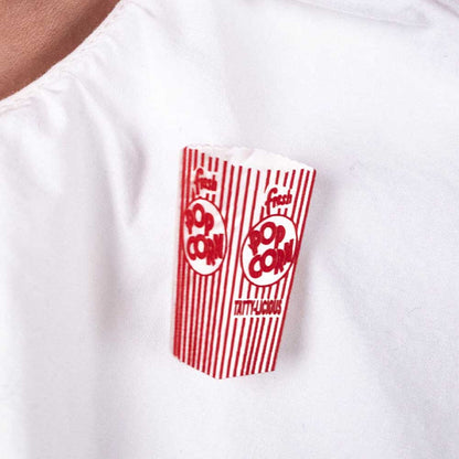 Popcorn brooch on a white shirt