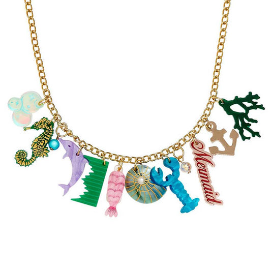 Tatty Devine seaside charm statement necklace: a seahorse, dolphin, lobster, mermaid script and coral on a gold chain
