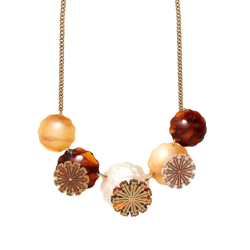 Tatty Devine seed pods necklace: amber and tortoiseshell discs and seed pod shapes on a gold chain