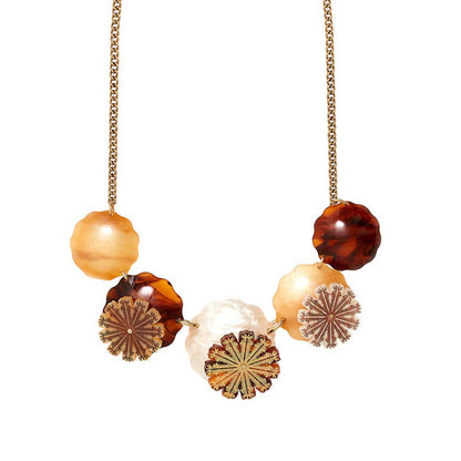 Tatty Devine seed pods necklace: amber and tortoiseshell discs and seed pod shapes on a gold chain