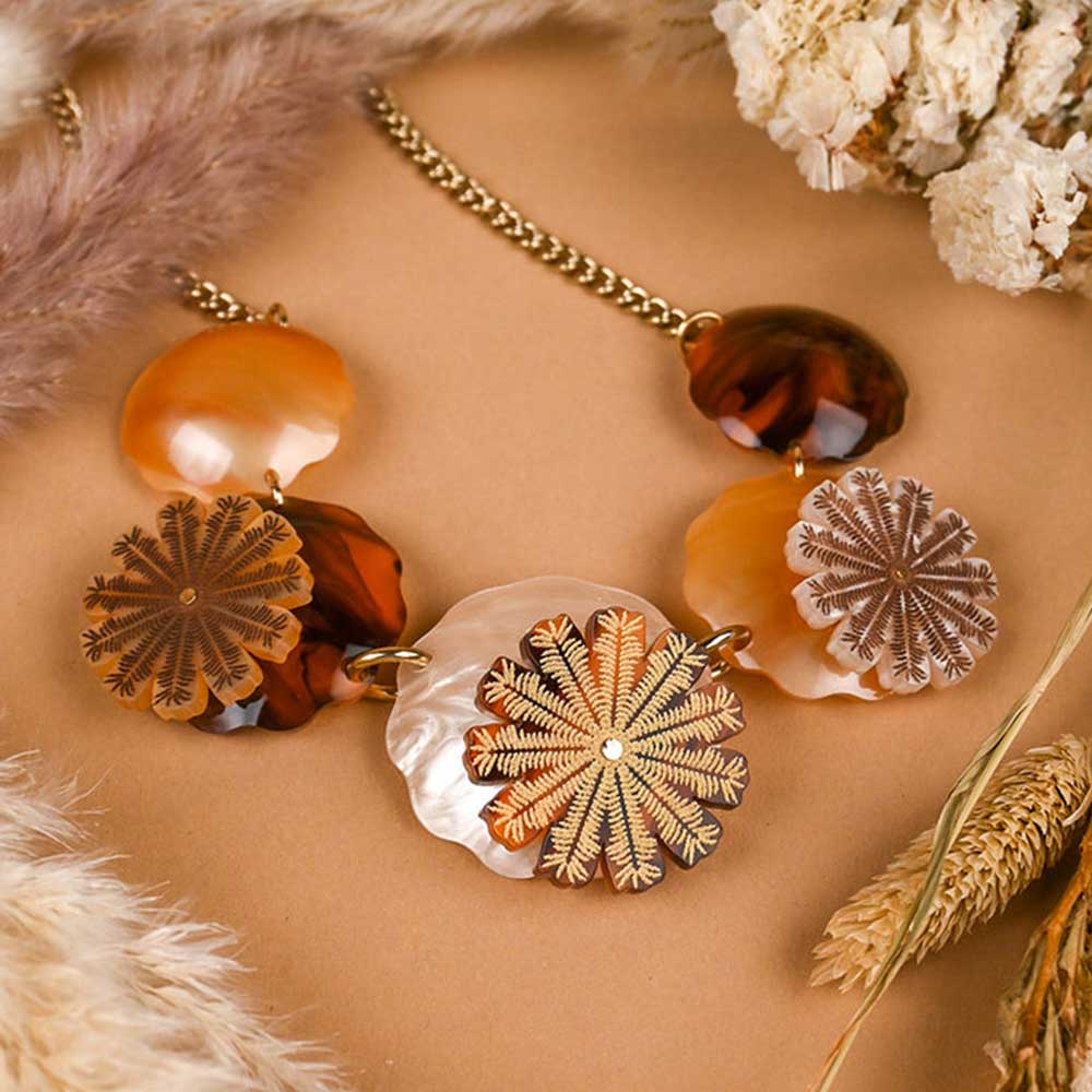 Seed pods necklace among dried flowers