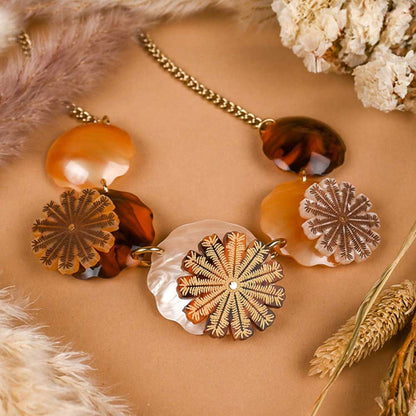 Seed pods necklace among dried flowers