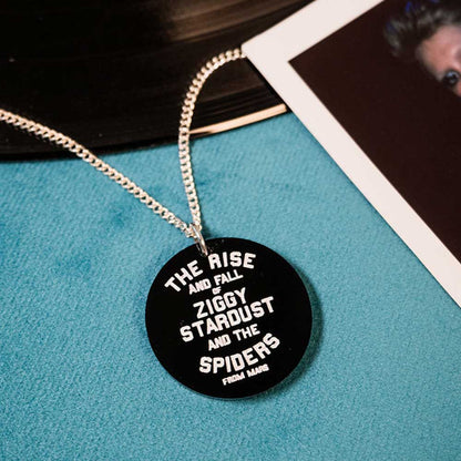 Spiders from Mars pendant lying on a record sleeve
