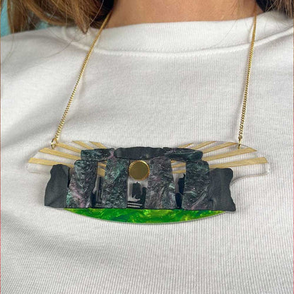 Close-up of the Stonehenge necklace on a cream jumper