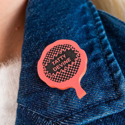 Whoopie cushion brooch on a denim jacket