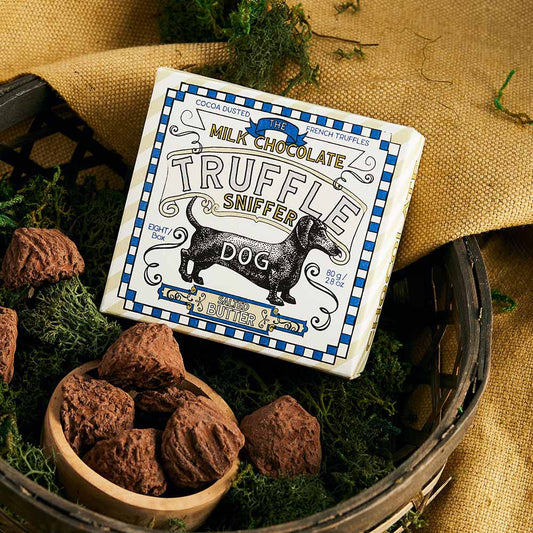 The Truffle Sniffer milk chocolate truffles in a box with a dachshund