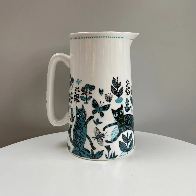 Blue cat jug on a white table