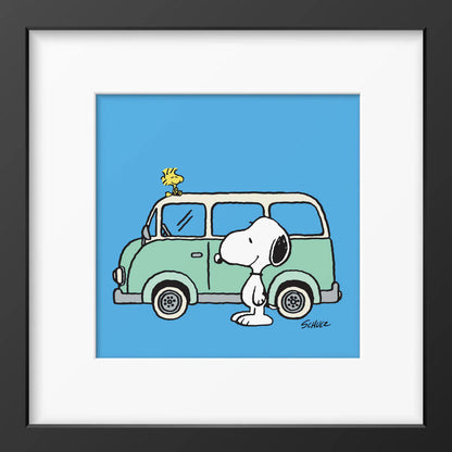 Peanuts framed print: Snoopy and Woodstock with a green camper van on blue, in a black frame